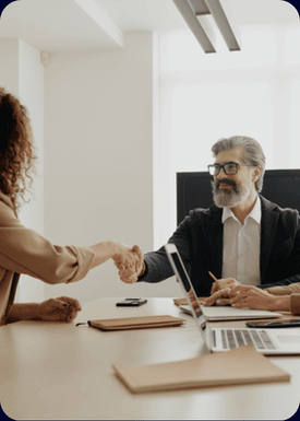 woman and man shaking hands on successful collaboration in one of the three crypto services: Crypto Analysis, Crypto Wallet Management and Crypto Recovery